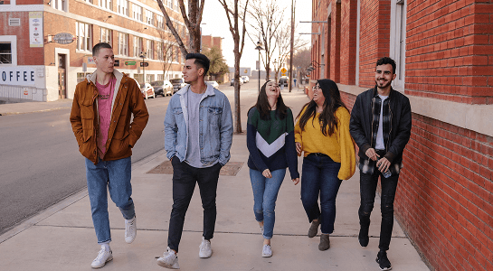 Group of diverse students walking together, building friendships
